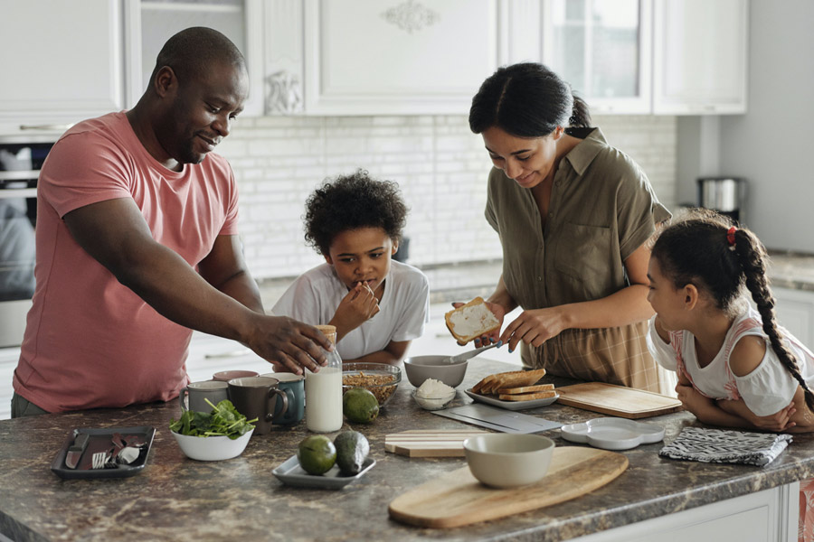 Family together in kitchen | NSURUS Life Insurance